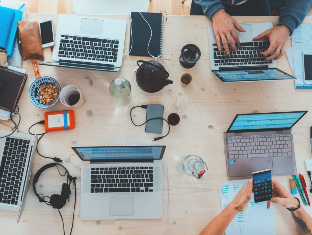 Overhead picture of tech startup workspace.